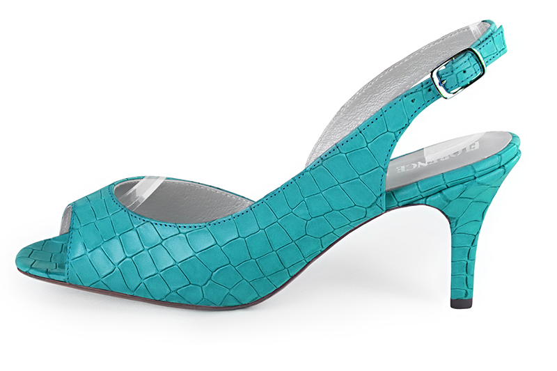 French elegance and refinement for these turquoise blue slingback dress sandals, 
                available in many subtle leather and colour combinations. This pretty open-toe pump will clear your toes,
without having the drawbacks of an uncomfortable multi-strap sandal.
To be personalized or not, with your choice of materials and colors.  
                Matching clutches for parties, ceremonies and weddings.   
                You can customize these sandals to perfectly match your tastes or needs, and have a unique model.  
                Choice of leathers, colours, knots and heels. 
                Wide range of materials and shades carefully chosen.  
                Rich collection of flat, low, mid and high heels.  
                Small and large shoe sizes - Florence KOOIJMAN
